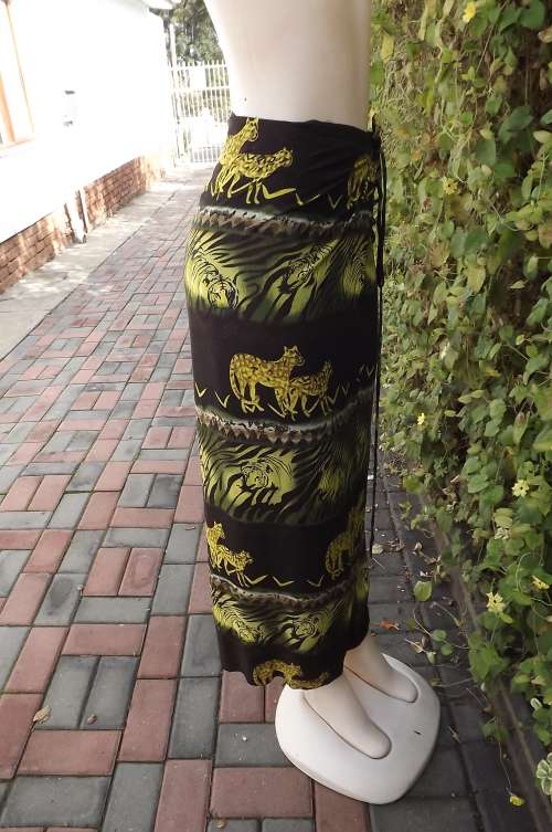 Black ankle length wrap around skirt with yellow green tiger border pattern.For size 32 to 36.As new