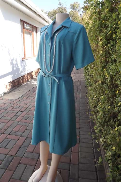 Turquoise "Karisma" button down dress in size 38/14.Yoked front.Plain dress with short sleeves