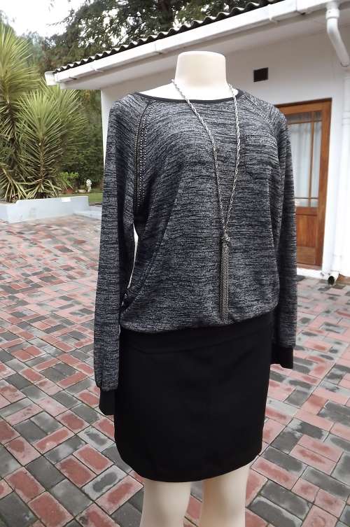 Black and white mottled top with embellishment by Cool ice.Size 38/14.As new