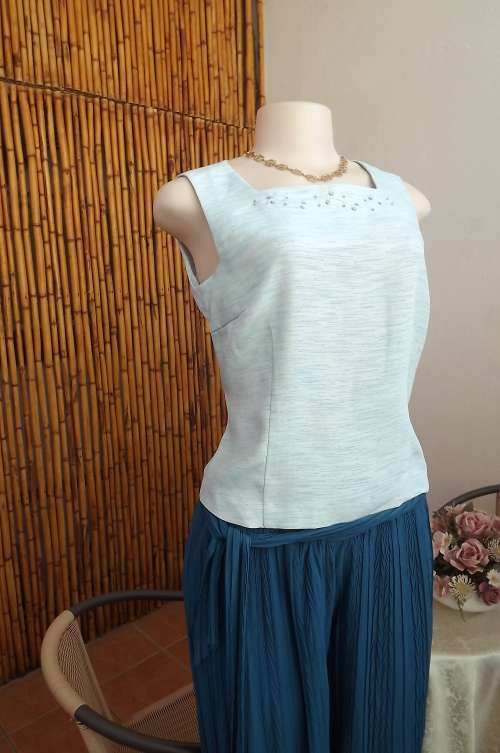 Fabulous light turquoise satin sleeveless top with square neckline.By Blancafe in size 34/10