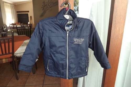 Navy padded jacket for 4 to 5 year old boy.By Waga Dude.Zipped up front with 2 zipped pockets