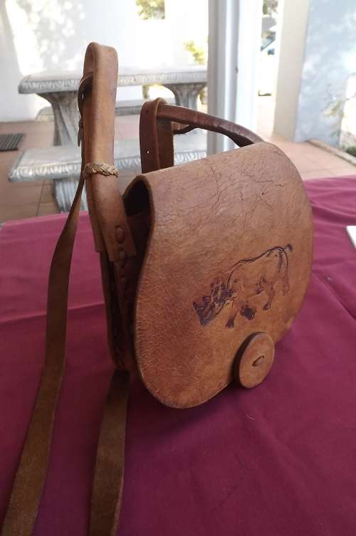 Tan colour genuine leather sling bag by Chui.Handmade in Tanzania.Three devisions for packing