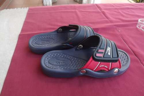 Pair of navy and res men's Kito sandels. Size 8.Can adjust width on top.Used once.