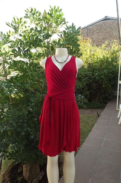 Hot red chic cocktail dress with crossover top.Size 32/8. Skirt also crossover with knife pleats