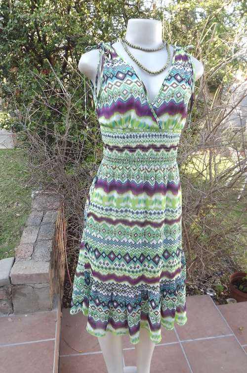 Sheer polyester dress in a burst of colour.Green,purple and blue horizontal patterns.Size 30/6.