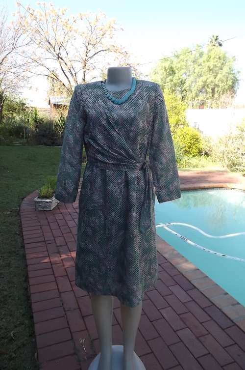 Exceptional dress from Japan.See-through pink and turquoise satin fabric.Size 34/10.Fully lined.