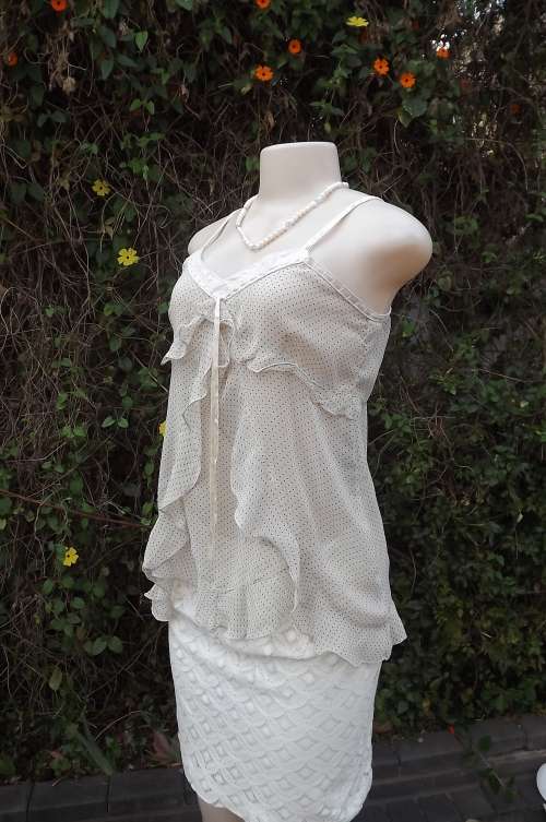 Fabulous cream top with tiny black polkadots. Lace shoulder straps and decoration.Size 38/14