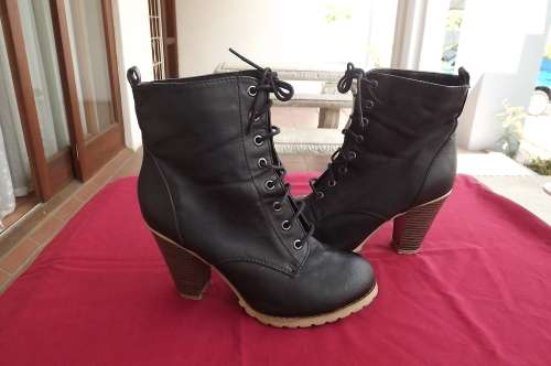 Pair of trendy short black laced boots in size  6.Faux leather with 7cm heel.As new