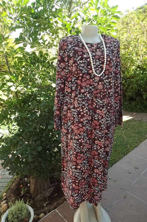 Pink/blue floral dress in fine corded cotton.Size 48/24.Easy to wear.Long sleeves.Jewel neckline