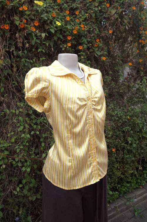 Yellow and white striped silky stretch polyester blouse size 38/14 by Lucy's.Capped sleeves