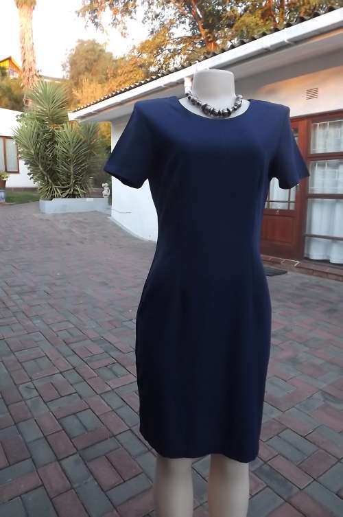 Classic navy pencil calf length dress with short sleeves.Size 34/10.Cotton/linen blend fabric