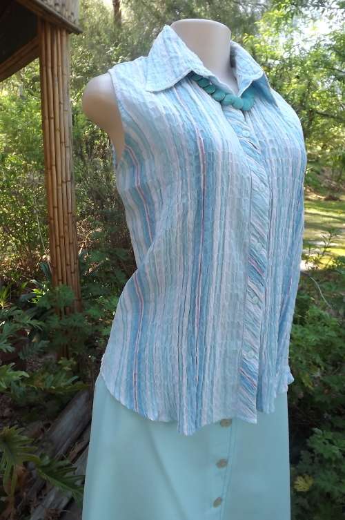 Pretty sleeveless top in cool smocked cotton fabric.Size 40/16 by C'SAR.Button down with open collar