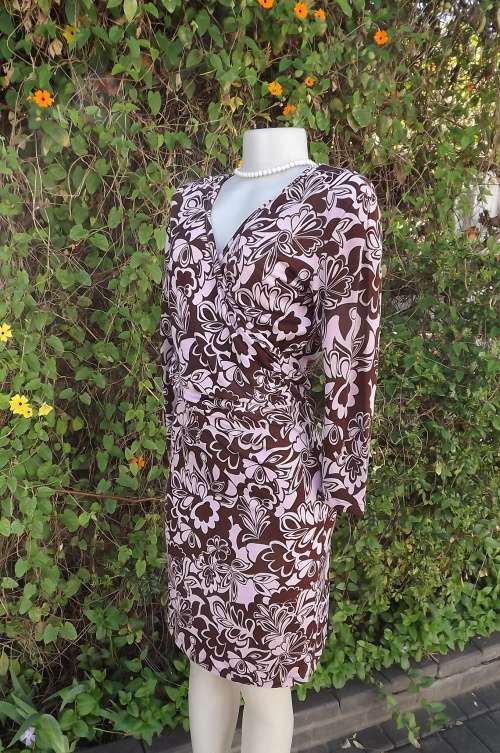Maroon/pink floral dress in stretch polyester..Cross over bust.Size 36/12.Calf length