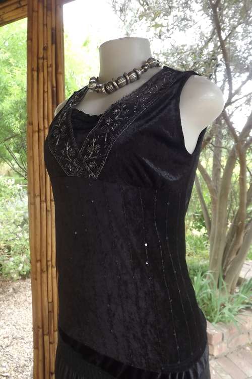 Black sleeveless velvet top by PAIX ET DOUX. Size 34/10 with some stretch.Embellished on front