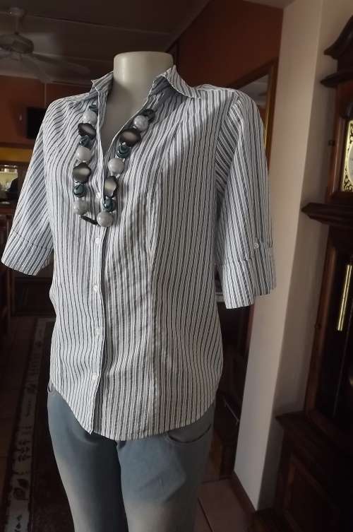 Beautiful navy,white and silver striped top by WOOLWORTHS. Size 38/14.Yoked at back.