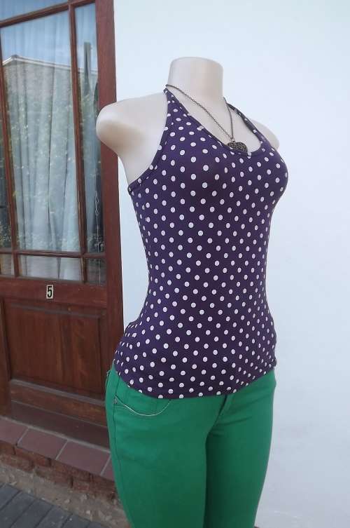 Very dark purple polyester stretch halter neck top with white polkadots. Size 32/8.New condition