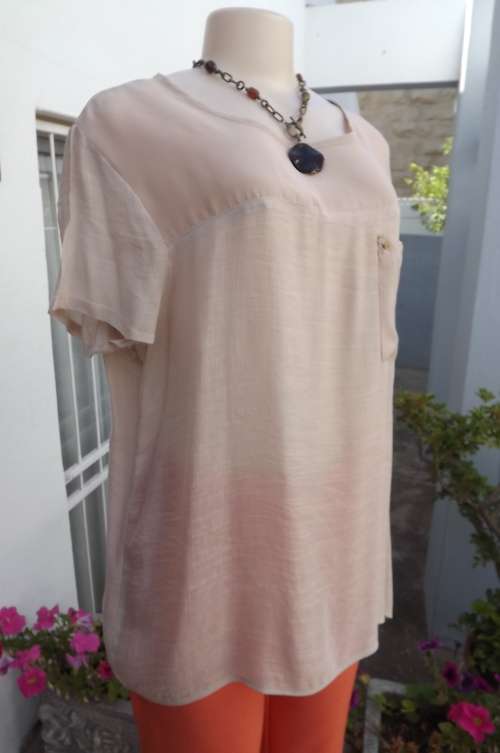 Pretty beige polyester/rayon top with capped sleeves with sheer polyester yoke and pocket.Size 42/18