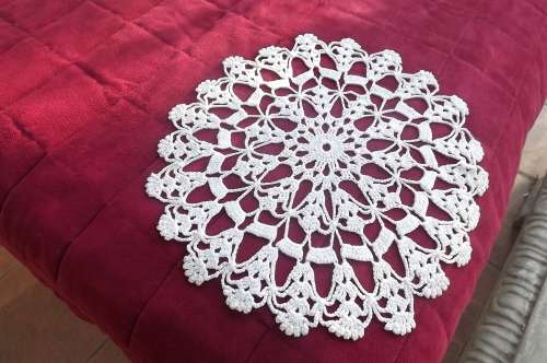 Doily crochet in a loose design with cotton yarn.As new.Diameter 28.5cm