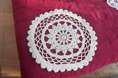Ecru colour doily crochet in thick cotton yarn.As new.Diameter 29cm