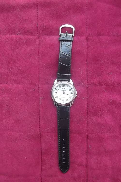 Men's QUARTZ watch by RHAETIA. Water resistant with faux leather strap.New watch