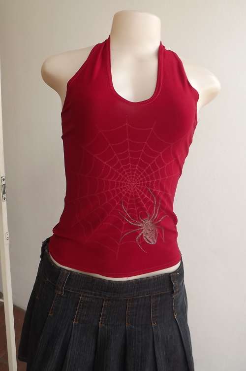 Dark red stretch polyester spider top with halter neck.Size 30/6.Beautiful design on front