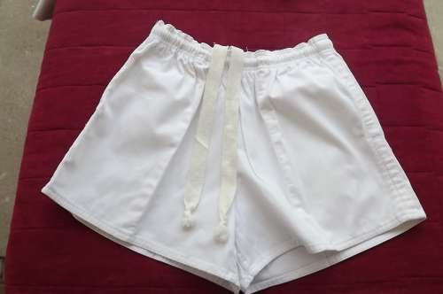 Boy's 100% cotton white boxer shorts with elasticated middle.Size 30.Side pockets.Used for an hour