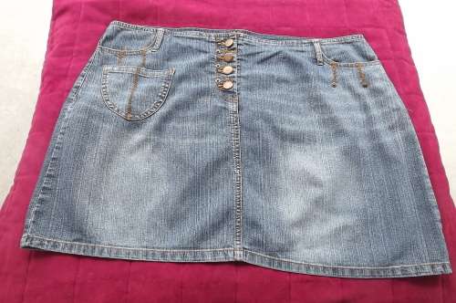 OBR denim mini skirt in size 42/18.In cotton stretch fabric.Open on front with buttons.