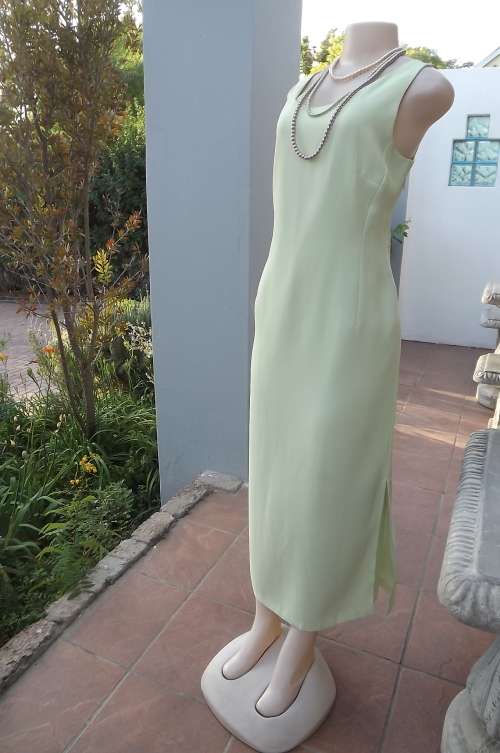 Flattering ankle length mint green princess style fully lined dress.Size 38/14 by FOSHINI. As new