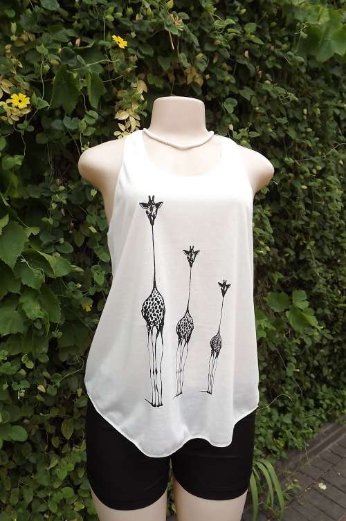 White stretch cotton vest type top with African design of 3 giraffes on front.Size 36/12.New