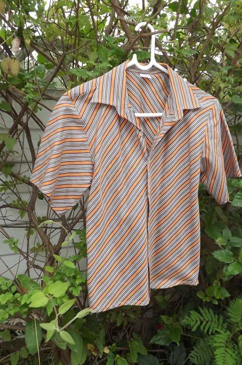 Beige and orange diagonally striped shirt by PANILINT for 10 to 11 year old boy.In as new condition