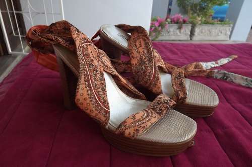 Pair of COLIN STUART high heel shoes with fabric uppers going around the ankles.Size 6