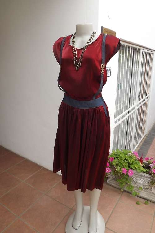 Dark red shiny satin/polyester dress with rounded neckline.Size 38/14 with denim band.