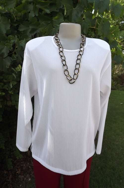 Sweater style long sleeve white permanent pleated top.Size 40/16 with rounded neckline.