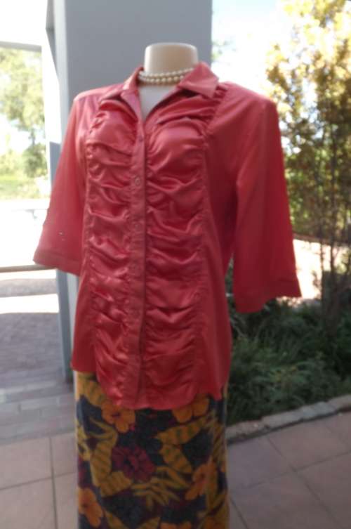 Glizy nectarine colour blouse with elbow lengthy sleeves.Size 38/14.Good condition
