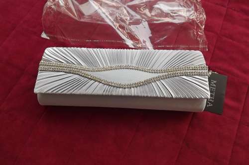 Silver satin evening clutch bag by METHA. Draped on front with imitation diamond decoration