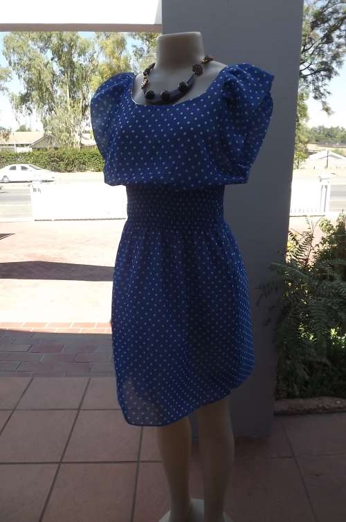 Chic royal blue dress with white polka dots.Size 34/10.In sheer wash + wear polyester.