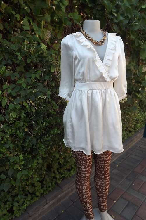 Romantic cream satin mini/long top with low frilled V neck front.Size 34/10 by LOAVES.