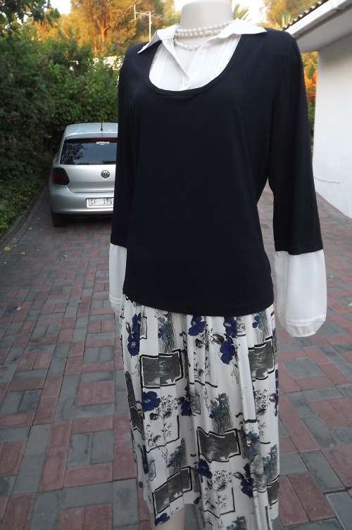 Finely detailed black stretch viscose top from WOOLWORTHS size 40/16.New condition