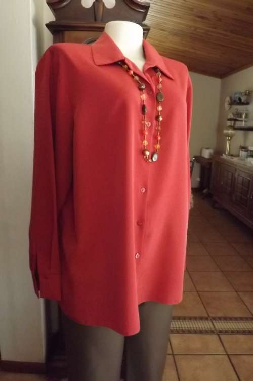 Classic long sleeve brick colour shirt with button down front.Size 42/18.Silky polyester fabric