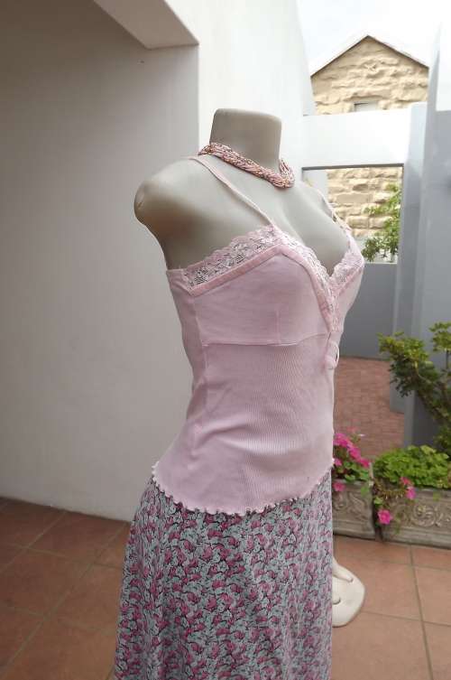 Soft pink cami in size 34/10 by WOOLWORTHS.In 100% cotton.Decorated with lace.As new