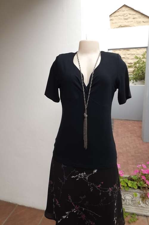 Beautiful black stretch viscose top in size 38/14 by WOOLWORTHS.Short sleeves with shaped V neck
