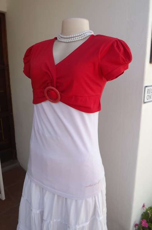 White stretch polycotton top with attached red bolero fastened with buckle.Size 36/12