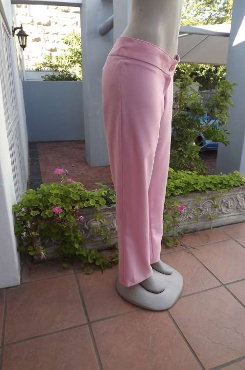 Carnation pink ladies pants in wash & wear polyester.Size37/13.Used but fine for everyday wear.