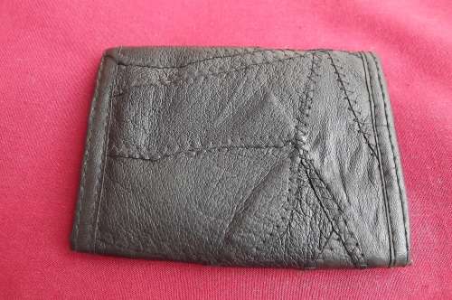 Men's black genuine patch work leather wallet.Can keep notes,change and cards.As new.Size 10 x 12cm