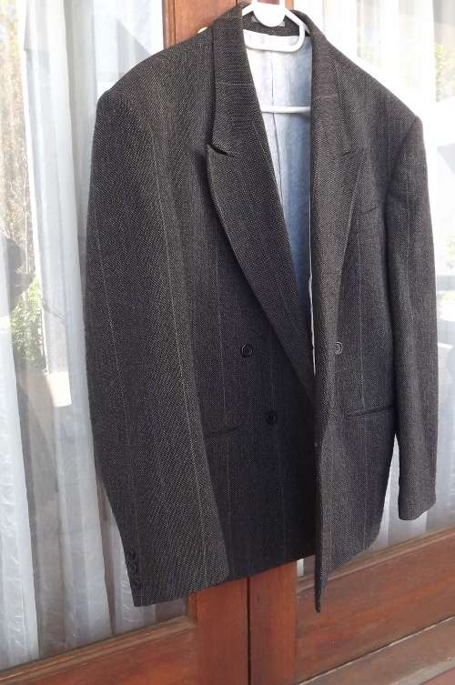Tweed jacket in dark grey with thin stripe double breast.By DE HAVILLAND in size 40/102cm