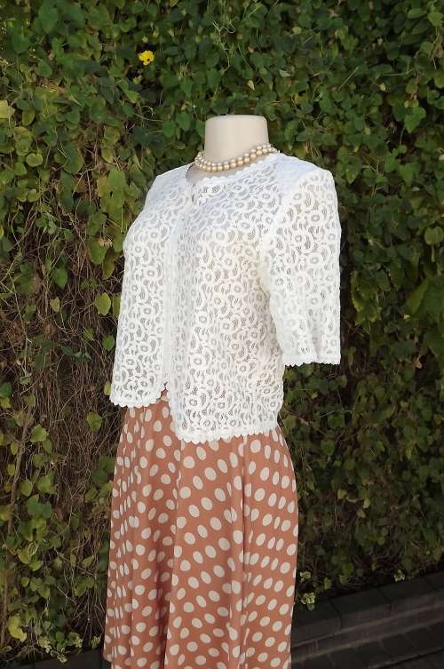 Beautiful dainty soft cream lace bolero in polycotton.Size 35/11 by FROHLICH.New item.