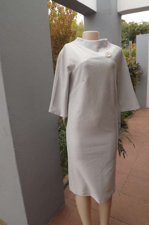 White & silver lame timeless evening dress.Size 34/10.Elbow length saddle sleeves.High cut neckline.