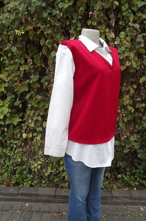 Trendy red,V neck top in heavy 100% polyester.Size 40/16.With white cotton collar, cuffed, sleeves