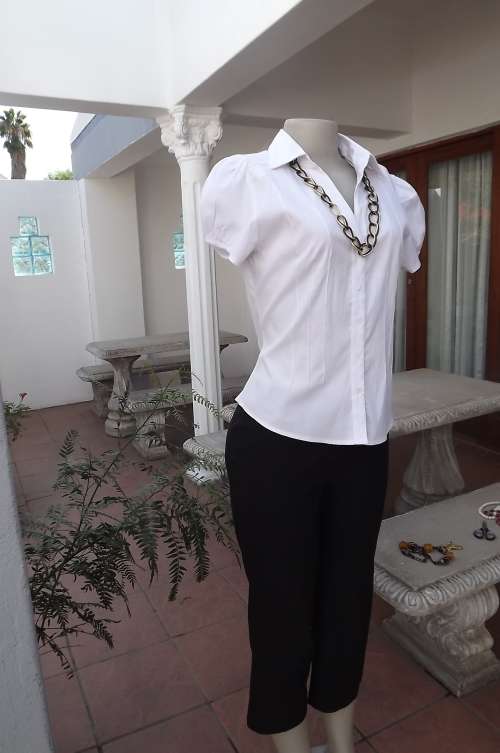 Pretty white AUDACITY capped sleeve blouse.Size 36/12.Button down with V front & open collar.