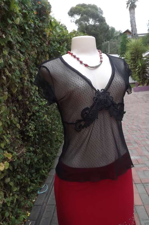 Sexy black see-through 100% nylon netting top with tiny polkadots.Size 34/10.New condition